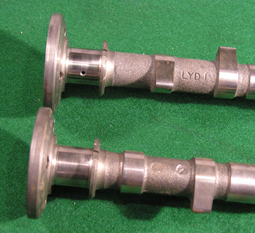 V12 Cams. Right side on top and left on bottom. Note spacing between  the bearing surface and first lobe.