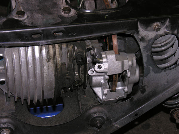 View from the rear of the XKE with one of the Rover calipers in place.
